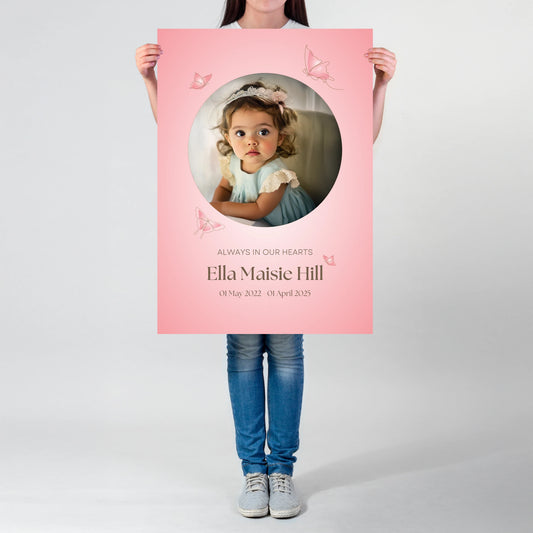 Memorial sign with a soft pink background, featuring a cherished photo, delicate butterfly accents, and personalised with the name "Ella Maisie Hill" and her dates. A beautiful tribute for remembrance and celebration of life.