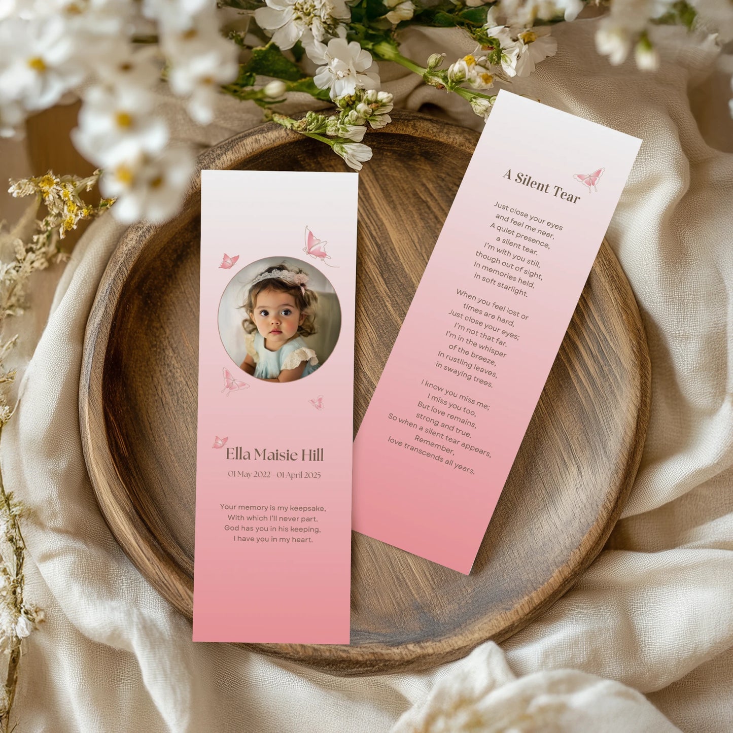 Personalised memorial bookmarks with elegant butterflies on a light pink background and a remembrance poem titled "A Silent Tear"—a heartfelt keepsake to honour a young loved one.