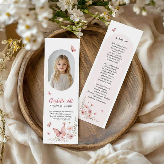 Personalised memorial bookmark for Charlotte Jill with pink butterflies, soft floral accents, and a remembrance poem titled "A Silent Tear"—a heartfelt keepsake to honour a young loved one.
