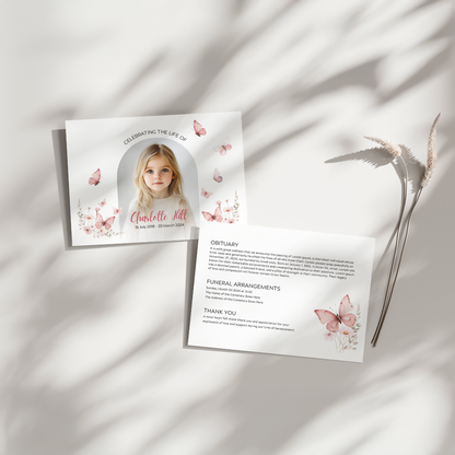 Personalised pink child memorial invitation with a photo of a young girl, butterfly illustrations, and elegant text for a heartfelt funeral service announcement.