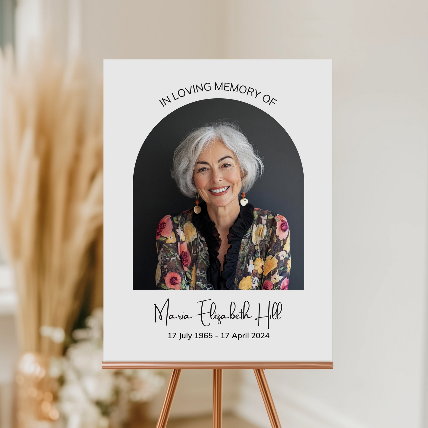 Memorial Welcome Sign with a photo framed in an elegant arch, featuring "In Loving Memory" above, a name in a delicate handwritten font, and birth and death dates at the bottom.