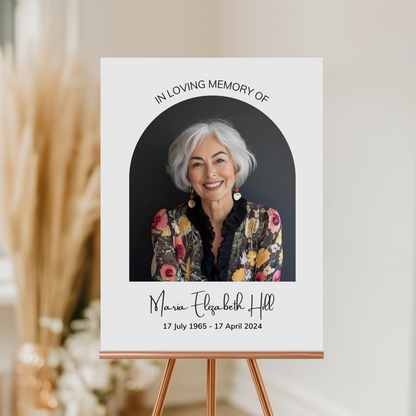 Memorial Welcome Sign with a photo framed in an elegant arch, featuring "In Loving Memory" above, a name in a delicate handwritten font, and birth and death dates at the bottom.