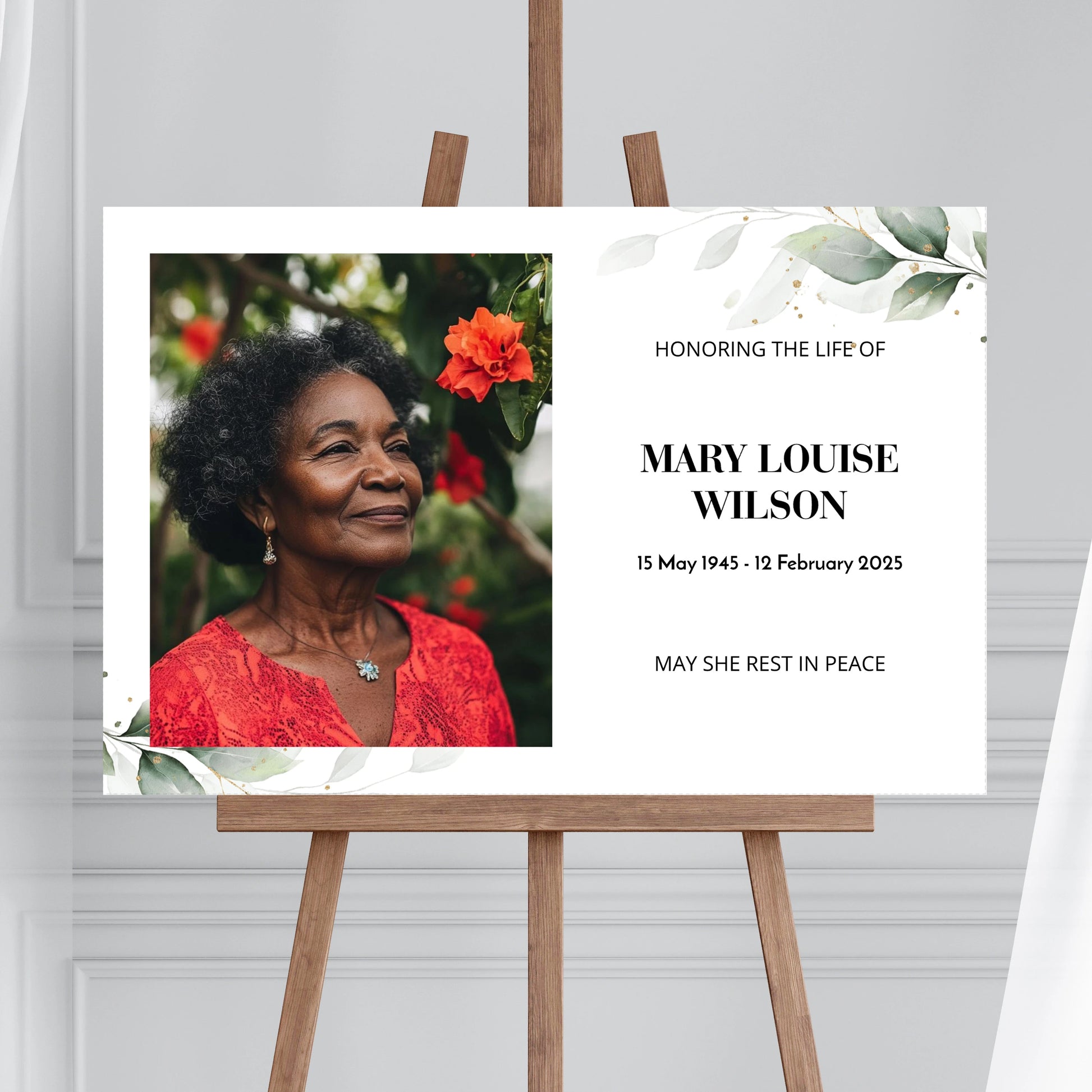 Memorial sign on a wooden easel at the beach, honouring a woman named Mary Louise Wilson. Features a soft eucalyptus design, her photo, name, and dates. Surrounded by white roses, candles, and flowers, creating a peaceful tribute.