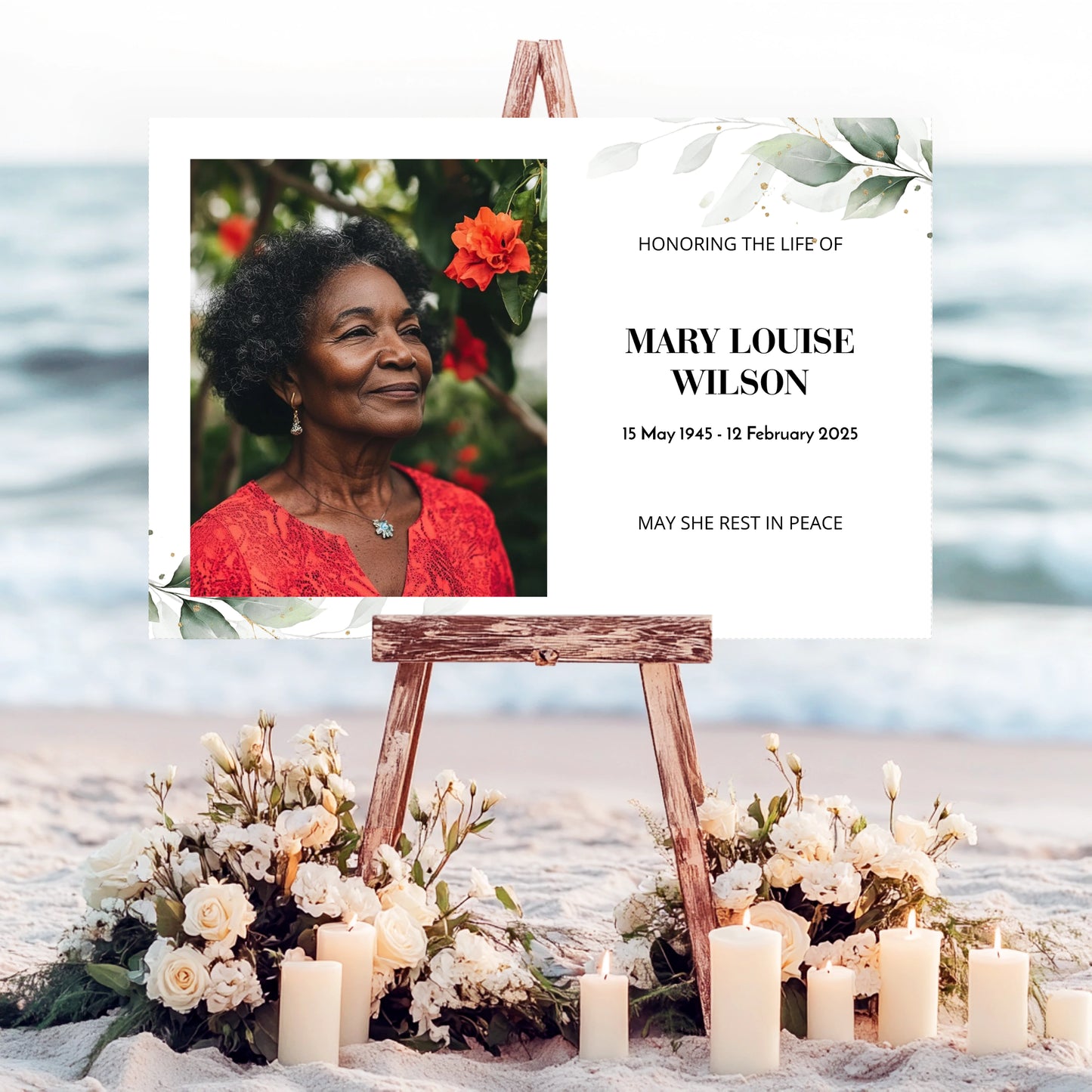 Memorial sign on a wooden easel at the beach, honouring a woman named Mary Louise Wilson. Features a soft eucalyptus design, her photo, name, and dates. Surrounded by white roses, candles, and flowers, creating a peaceful tribute.