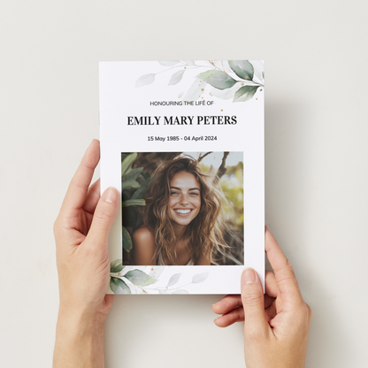 Elegant funeral order of service, single-fold memorial brochure with eucalyptus and photograph.